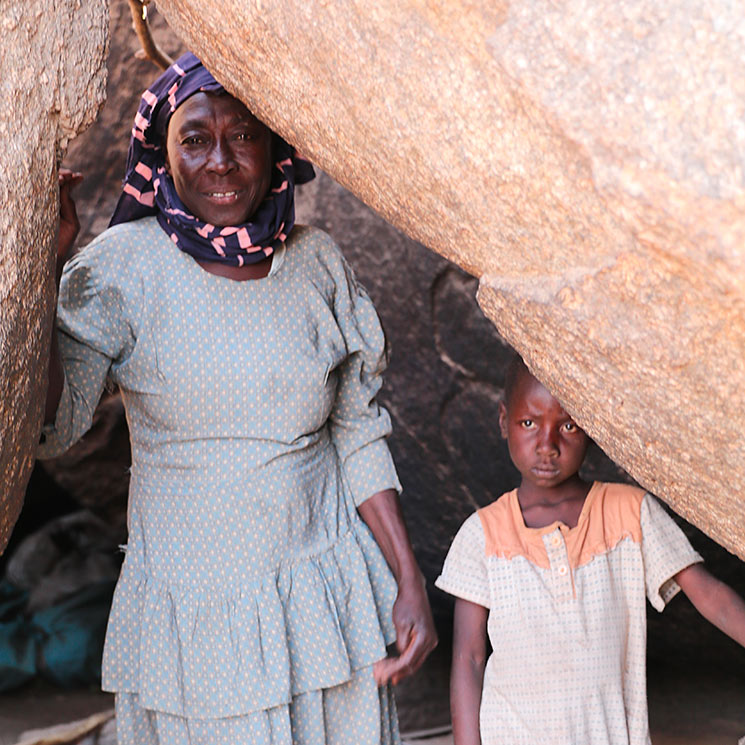Woman and child hiding in cave