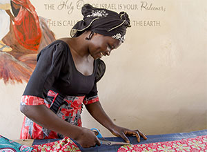 Woman cutting out pattern